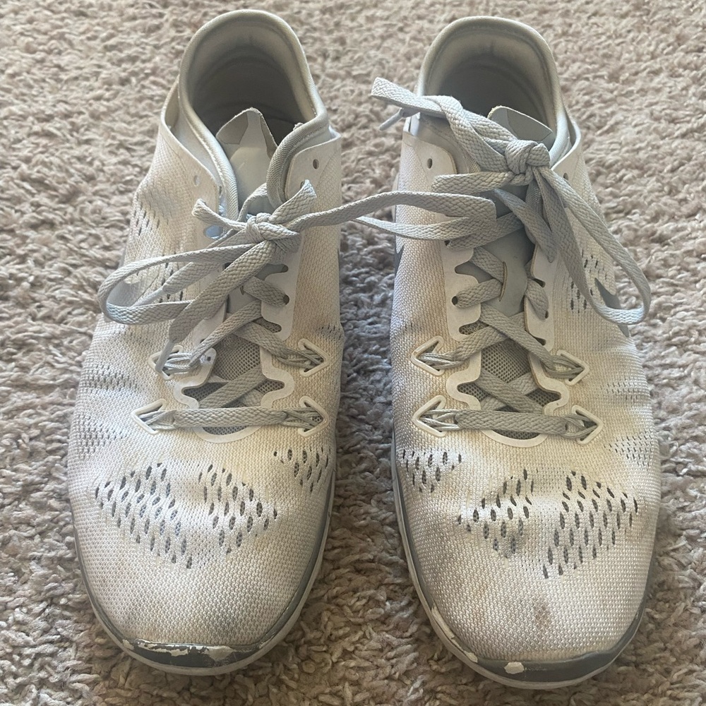 Well loved white and Gray Nike’s Women’s Sneakers. Size 7.